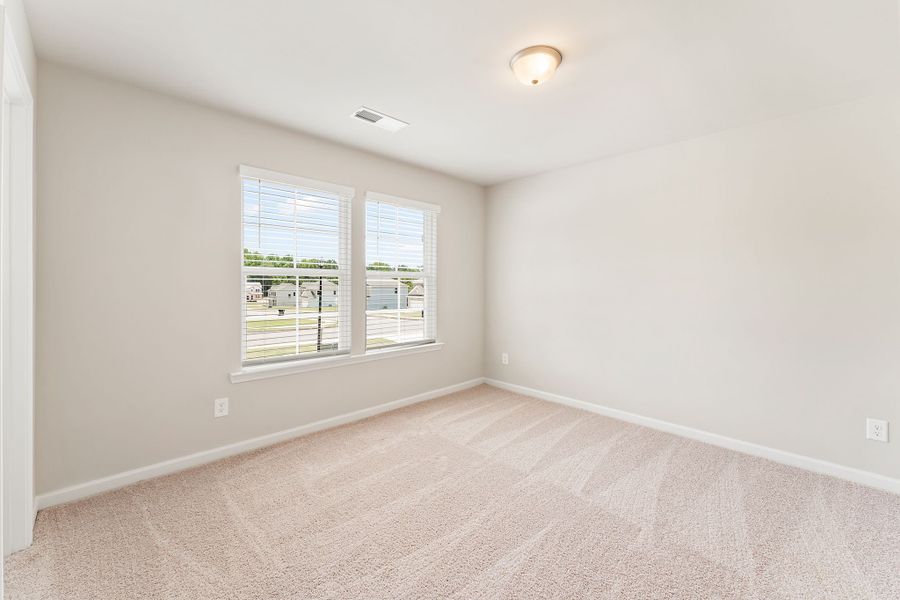 Bedroom #3 with walk-in closet and large windows