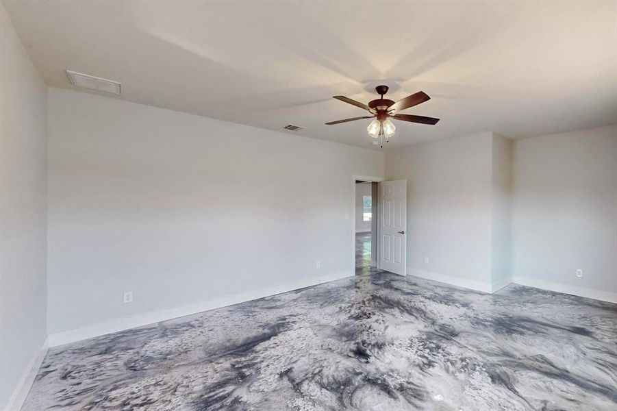 Unfurnished room featuring ceiling fan