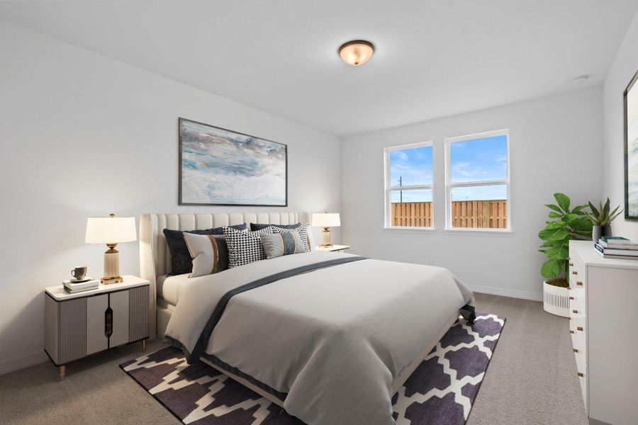 The primary bedroom is generously sized, creating a tranquil and spacious retreat that offers ample room for relaxation. Featuring plush carpet, high ceilings, fresh paint, and large windows that lets in natural lighting throughout the day.