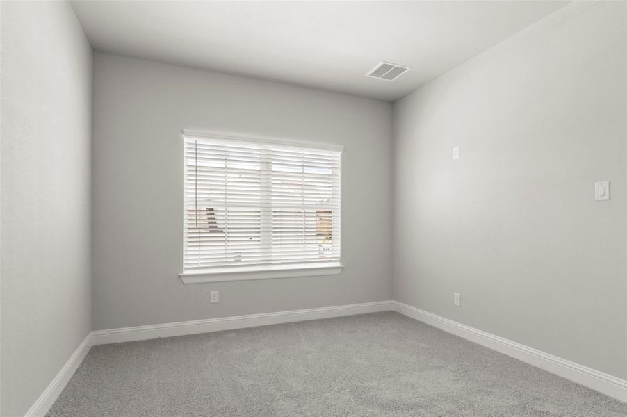 Spare room featuring carpet and baseboards Spare room featuring carpet and baseboards