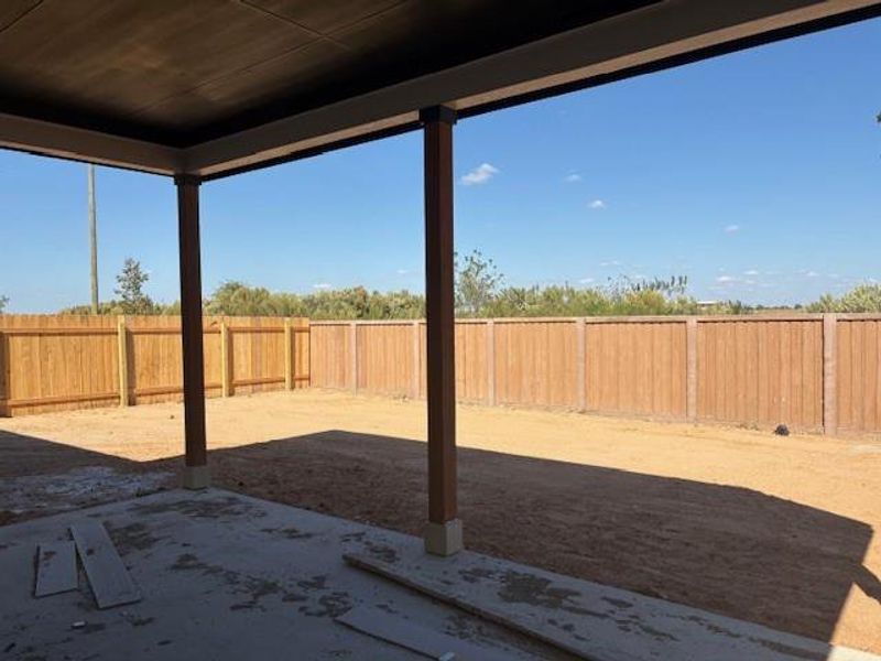 Fenced backyard with a patio Fenced backyard with a patio