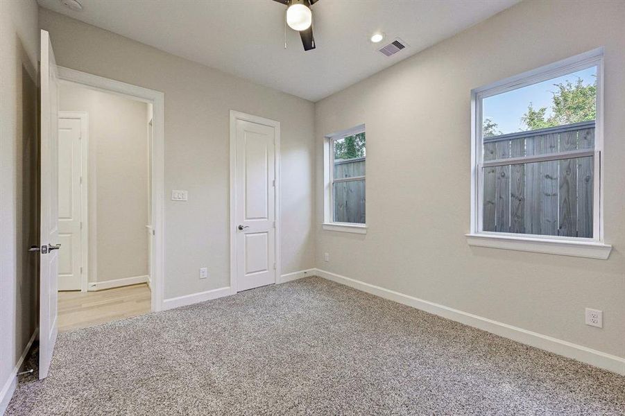 Another view of the first bedroom facing the walk-in closet.