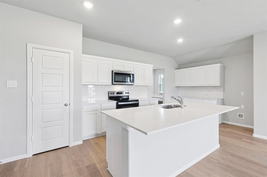 Kitchen in the Harrison home plan by Trophy Signature Homes – REPRESENTATIVE PHOTO Kitchen in the Harrison home plan by Trophy Signature Homes – REPRESENTATIVE PHOTO