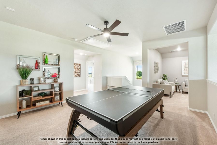 Game room with ping pong table, ceiling fan, and carpet flooring open to sitting area Game room with ping pong table, ceiling fan, and carpet flooring open to sitting area