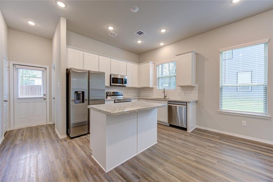 Huge island kitchen, window over the sink & granite counters!