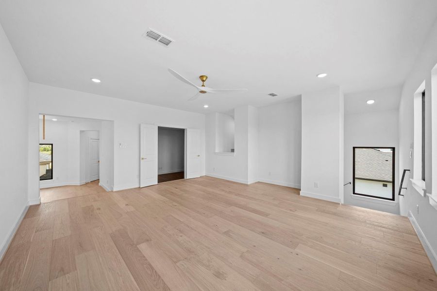Large upstairs retreat with generous space for a media or game room setup.