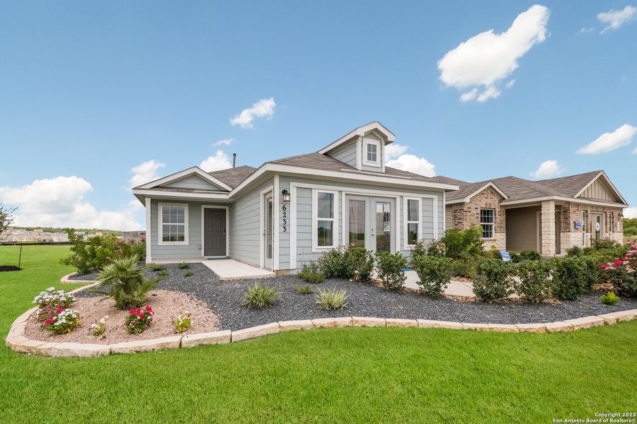 Front exterior of a new home in Navarro Ranch: Cottage Collection, Seguin, TX, highlighting curb appeal (Image 1). Front exterior of a new home in Navarro Ranch: Cottage Collection, Seguin, TX, highlighting curb appeal (Image 1).