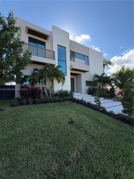 Front exterior of a new home in , Hollywood, FL, highlighting curb appeal (Image 2).