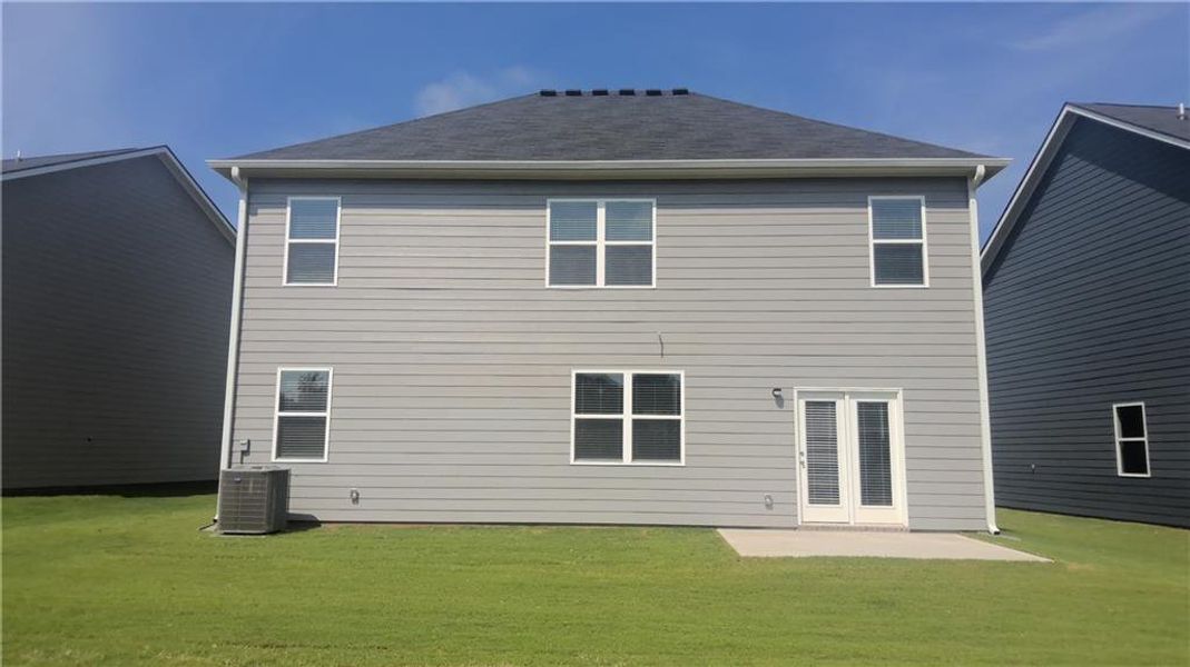 Exterior details and patio area of a home in Teamon Pointe, Griffin (Image 3).