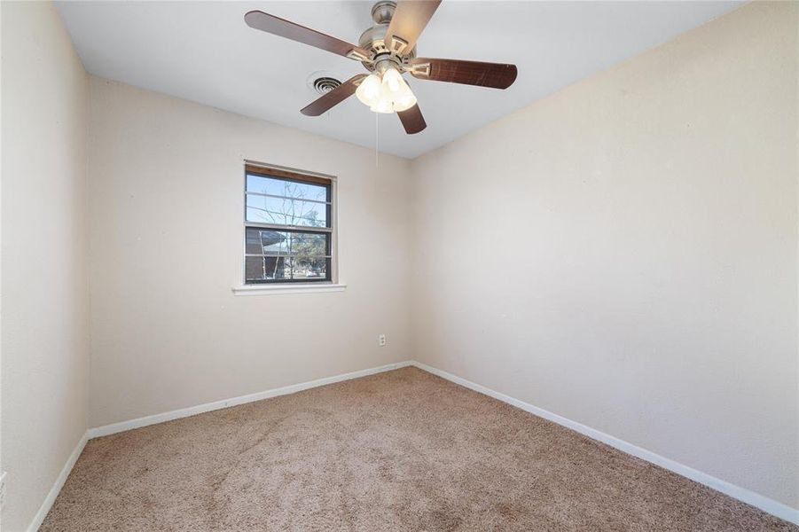 Bedroom with ceiling fan and carpet flooring