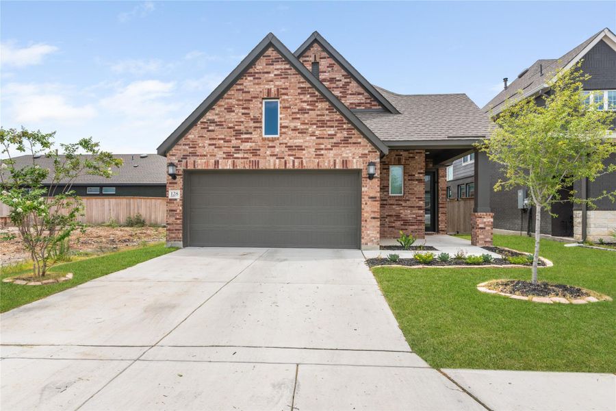 Front exterior of a new home in Mayfair - Select Garden Series, New Braunfels, TX, highlighting curb appeal (Image 2). Front exterior of a new home in Mayfair - Select Garden Series, New Braunfels, TX, highlighting curb appeal (Image 2).
