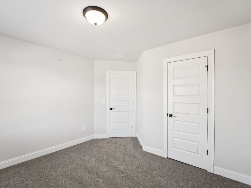 Spacious, unfurnished interior of a new home in Hemingway - Highland Series, Cumming (Image 18).