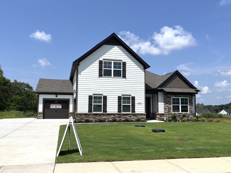 Front exterior of a new home in Brewer Point, Murfreesboro, TN, highlighting curb appeal (Image 1). Front exterior of a new home in Brewer Point, Murfreesboro, TN, highlighting curb appeal (Image 1).