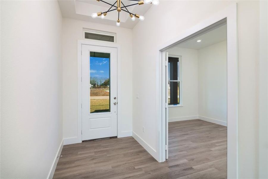 Foyer featuring a chandelier and light hardwood / wood-style flooring