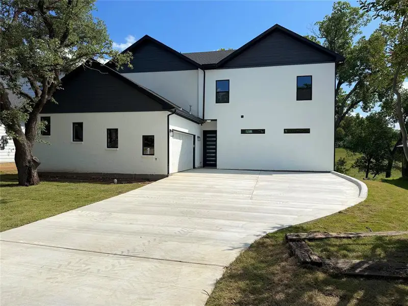 Front exterior of a new home in , Fort Worth, TX, highlighting curb appeal (Image 1). Front exterior of a new home in , Fort Worth, TX, highlighting curb appeal (Image 1).