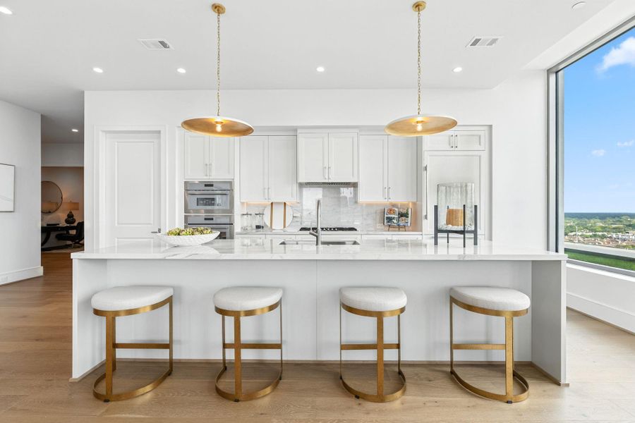 Distinct style, innovative features and personalized details. A dream kitchen with center island, stunning counter-top, breakfast bar with pull-oit seating allowing a spot for gourmet meal or morning coffee Distinct style, innovative features and personalized details. A dream kitchen with center island, stunning counter-top, breakfast bar with pull-oit seating allowing a spot for gourmet meal or morning coffee