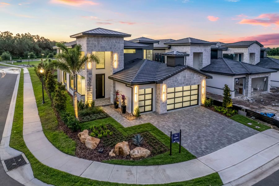 Front exterior of a new home in Hampton Green at Providence, Davenport, FL, highlighting curb appeal (Image 6).