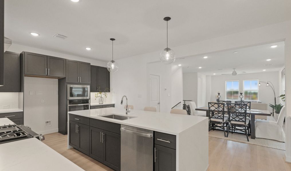 Kitchen with vast island & pendant lights Kitchen with vast island & pendant lights