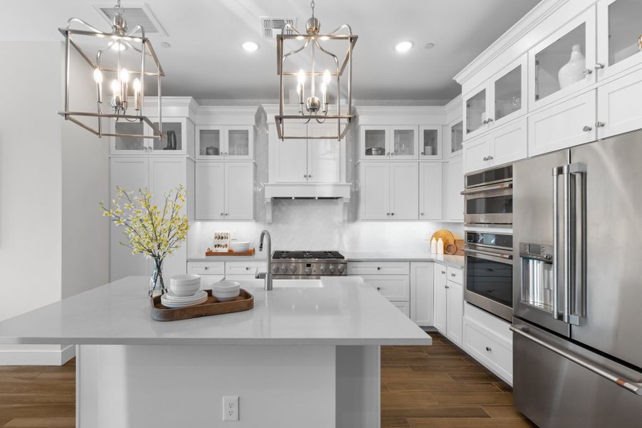 Kitchen with pendant lighting and glass upper cabinets Kitchen with pendant lighting and glass upper cabinets