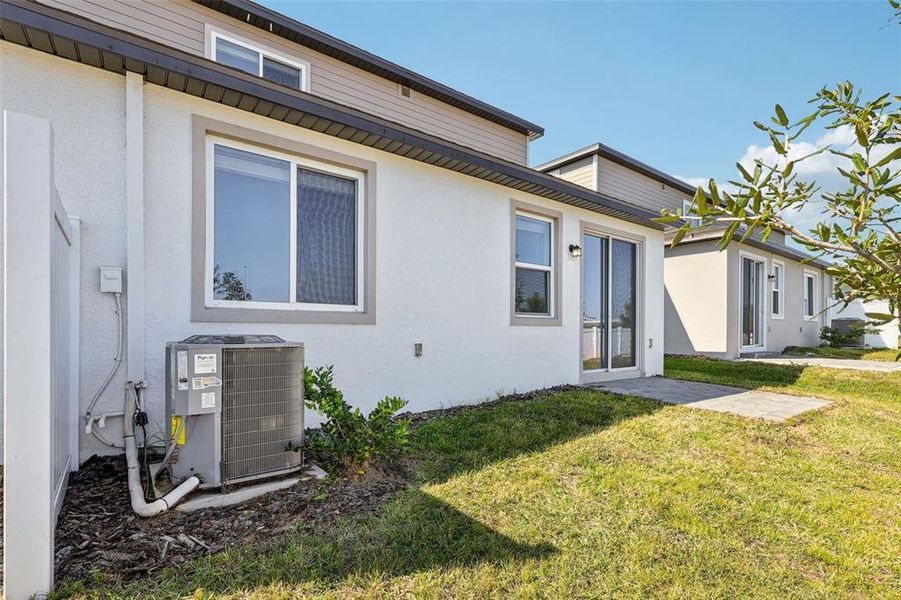 Exterior details and patio area of a home in Cyrene at Minneola - Villas, Minneola (Image 4).