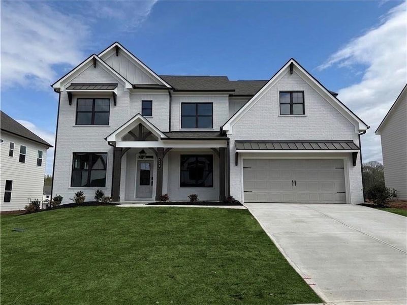 Front exterior of a new home in Rosewood Lake Estates, Hoschton, GA, highlighting curb appeal (Image 2). Front exterior of a new home in Rosewood Lake Estates, Hoschton, GA, highlighting curb appeal (Image 2).