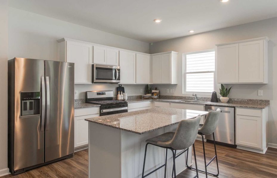 Spacious Kitchen with classic white cabinets.
