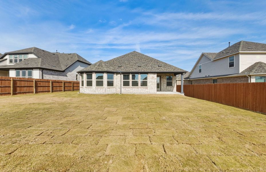 Exterior details and patio area of a home in Saddleback at Santa Rita Ranch, Liberty Hill (Image 26).