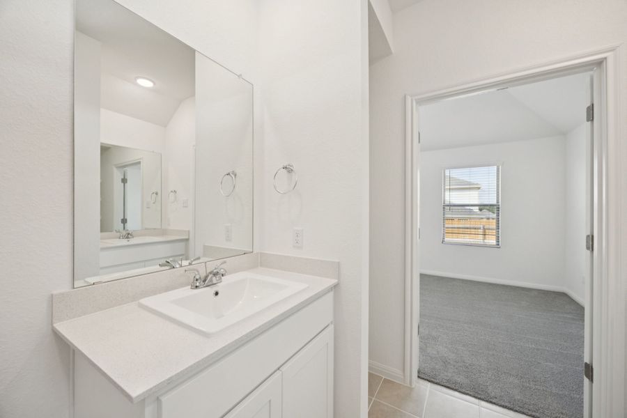 Primary Bathroom in the Redbud home plan by Trophy Signature Homes - REPRESENTATIVE PHOTO