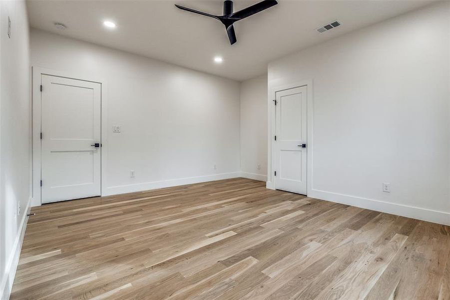 Unfurnished room featuring ceiling fan and light hardwood / wood-style flooring