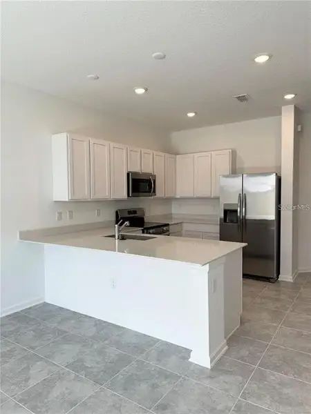 Furnished interior view inside a new home in , Kissimmee (Image 4).