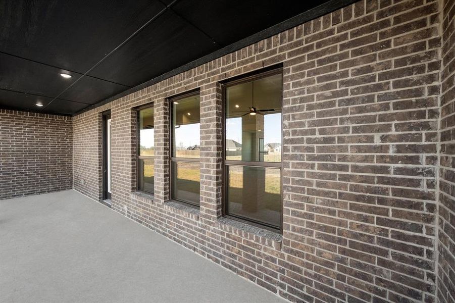 Exterior details and patio area of a home in Estates of Palmer, Palmer (Image 19).