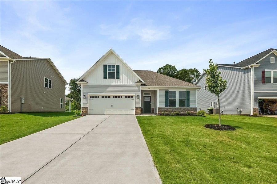 Front exterior of a new home in Lynbrook, Boiling Springs, SC, highlighting curb appeal (Image 1). Front exterior of a new home in Lynbrook, Boiling Springs, SC, highlighting curb appeal (Image 1).