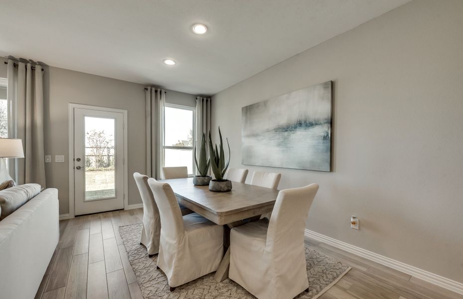 Dining area off kitchen with large window