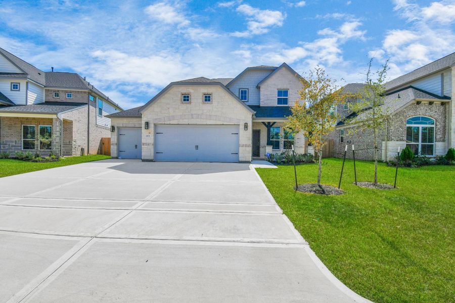 Home features a convenient 2-car garage complemented by a spacious driveway, offering ample parking for you and your guests. Home features a convenient 2-car garage complemented by a spacious driveway, offering ample parking for you and your guests.