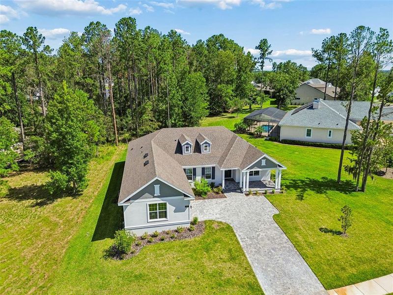 Front exterior of a new home in Southern Hills Plantation, Brooksville, FL, highlighting curb appeal (Image 29). Front exterior of a new home in Southern Hills Plantation, Brooksville, FL, highlighting curb appeal (Image 29).