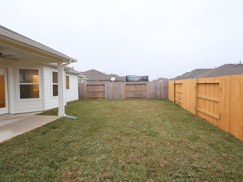 Exterior details and patio area of a home in Magnolia Ridge, Magnolia (Image 22).