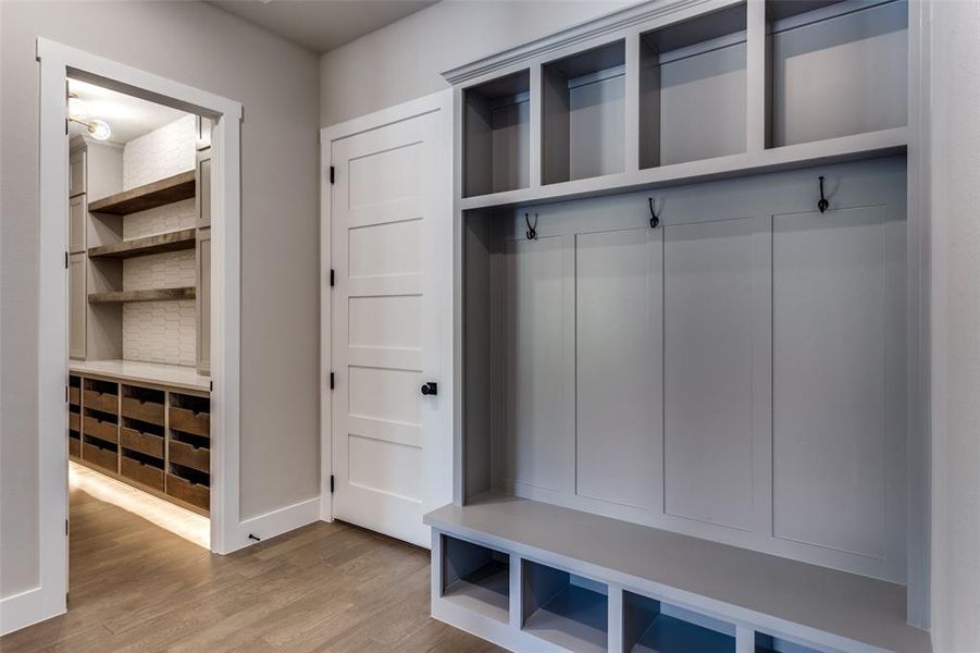 Mudroom with light wood-type flooring and baseboards Mudroom with light wood-type flooring and baseboards