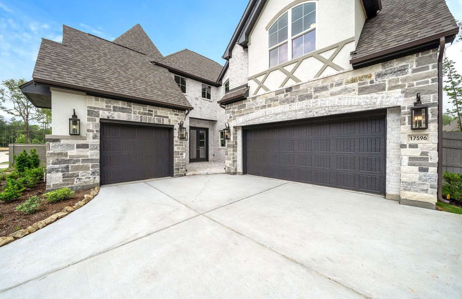 Representative exterior photo of a completed home built from the 4094 by Ravenna Homes in Artavia 70′, Conroe, TX (Image 25).
