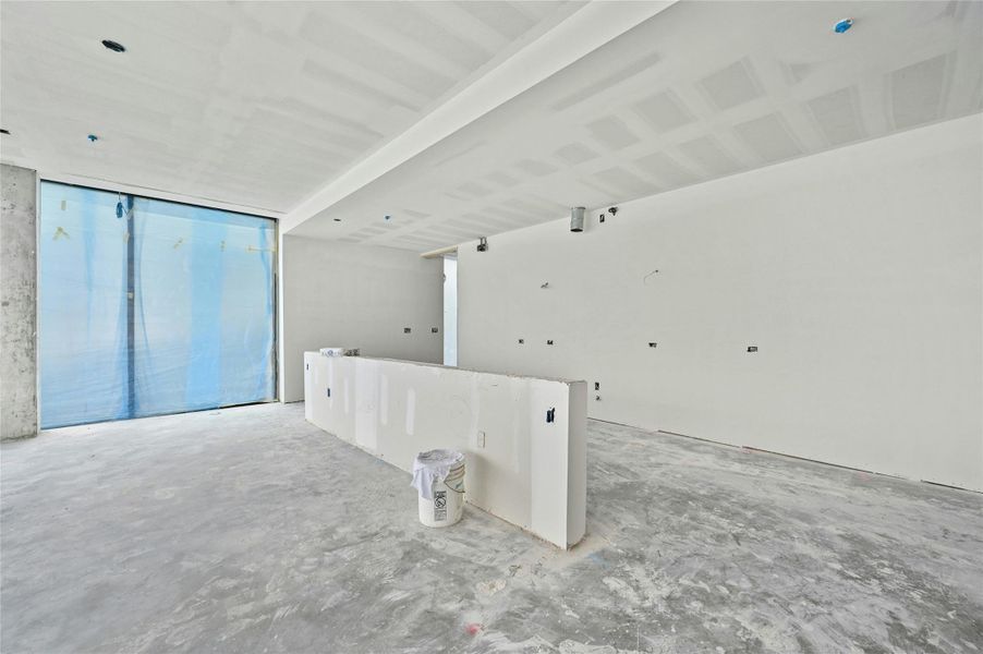 Spare room with unfinished concrete floors