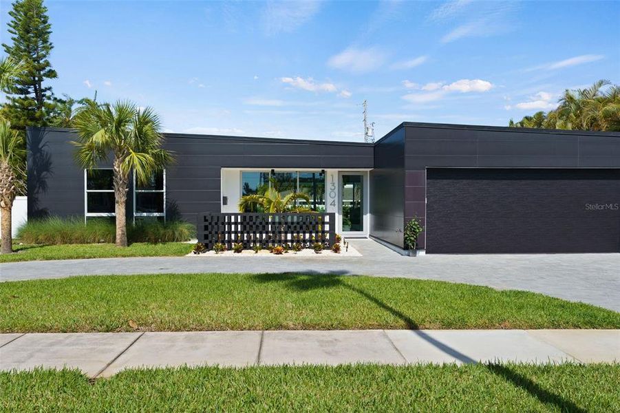 Front exterior of a new home in , Belleair, FL, highlighting curb appeal (Image 24).