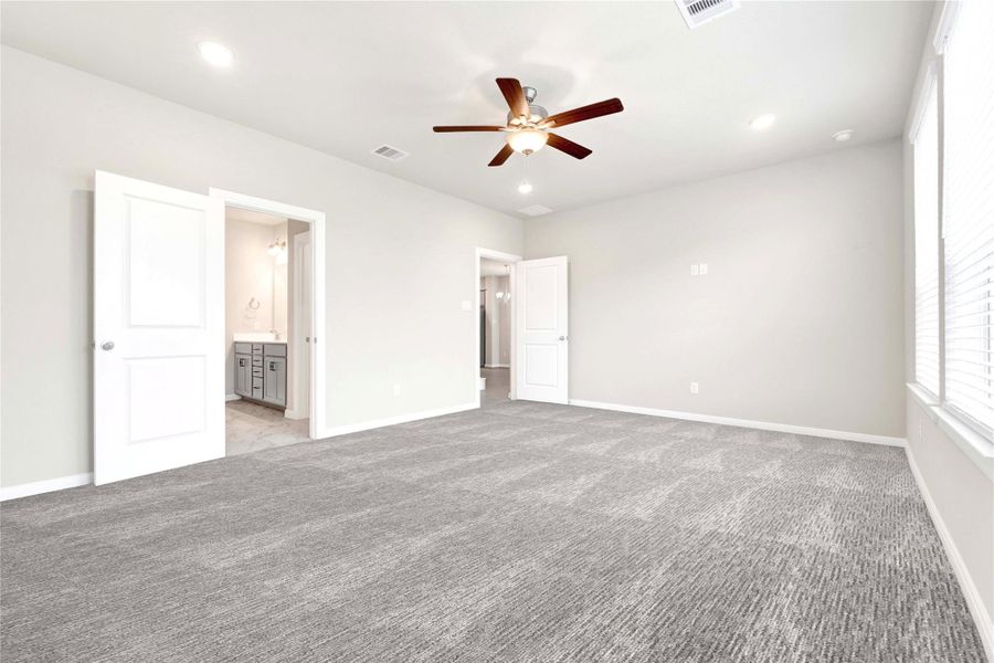 Extended primary bedroom with high ceilings