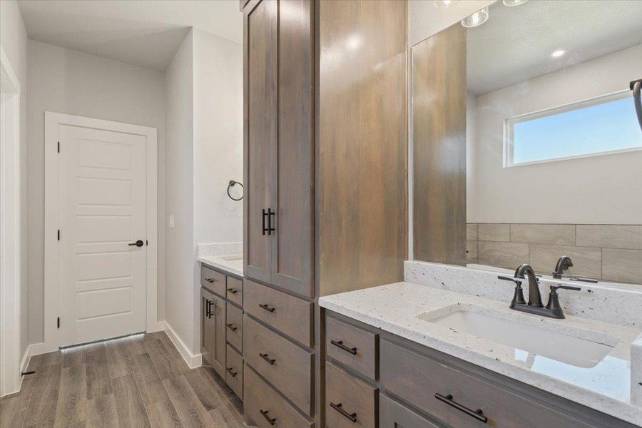 Bathroom featuring vanity and light wood-type flooring