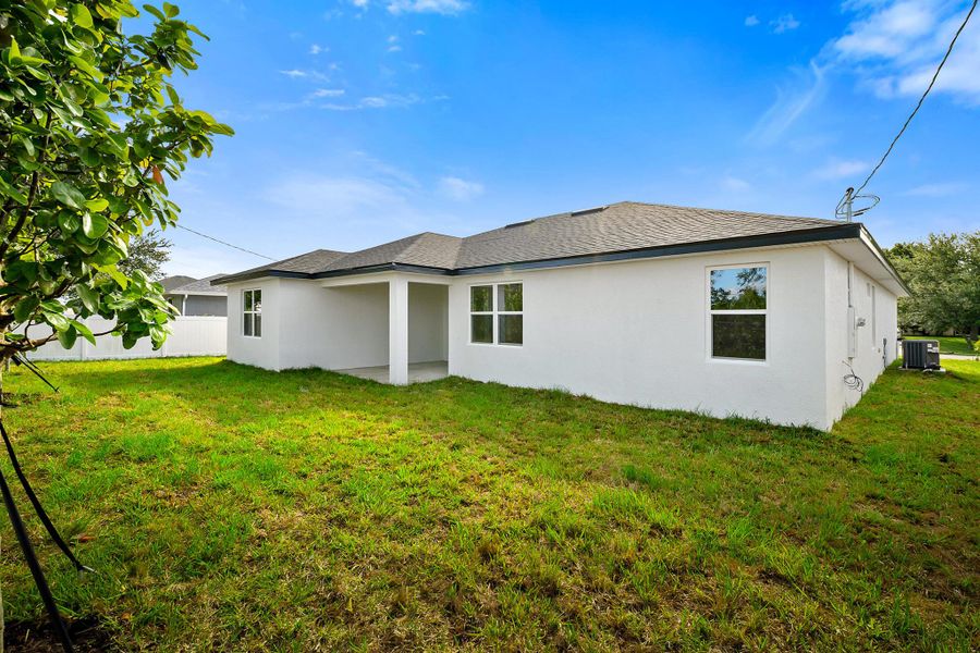 Front exterior of a new home in , Port St. Lucie, FL, highlighting curb appeal (Image 2). Front exterior of a new home in , Port St. Lucie, FL, highlighting curb appeal (Image 2).