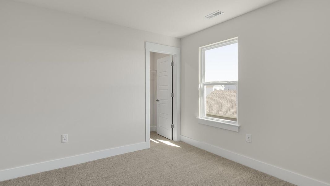 Spacious, unfurnished interior of a new home in Sidbury Station, Castle Hayne (Image 32).