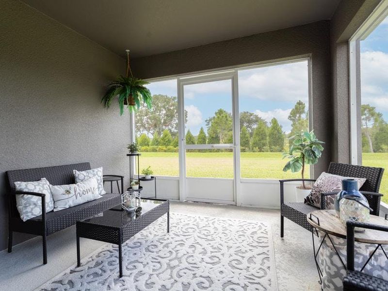 The cafe opens to outdoor living space on your covered lanai - Paisley by Highland Homes