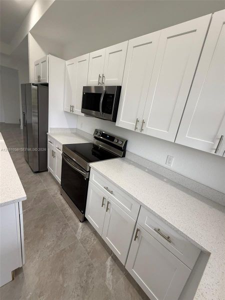 Furnished interior view inside a new home in , Lehigh Acres (Image 11).