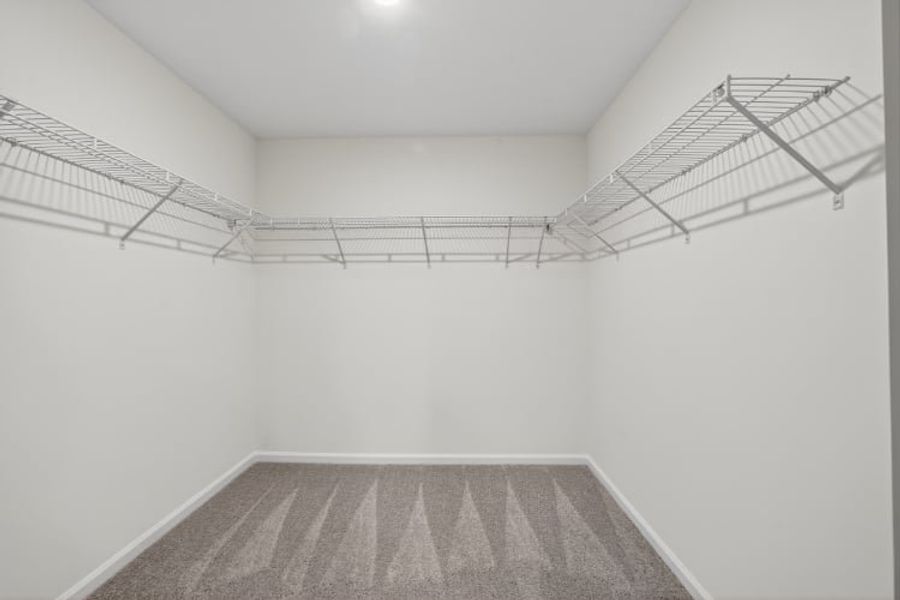 A white room with a staircase.