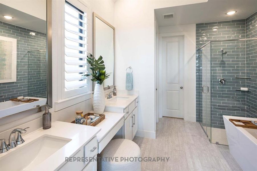 Full bathroom featuring a shower stall, a soaking tub, light wood-style flooring, recessed lighting, and vanity Full bathroom featuring a shower stall, a soaking tub, light wood-style flooring, recessed lighting, and vanity