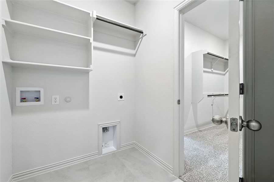 Washroom featuring hookup for a washing machine, hookup for an electric dryer, and hookup for a gas dryer