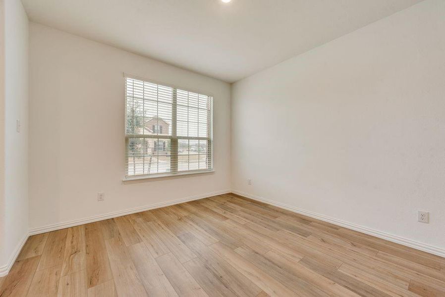 Unfurnished room with light hardwood / wood-style flooring